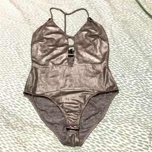 Silver bodysuit with plunging neckline